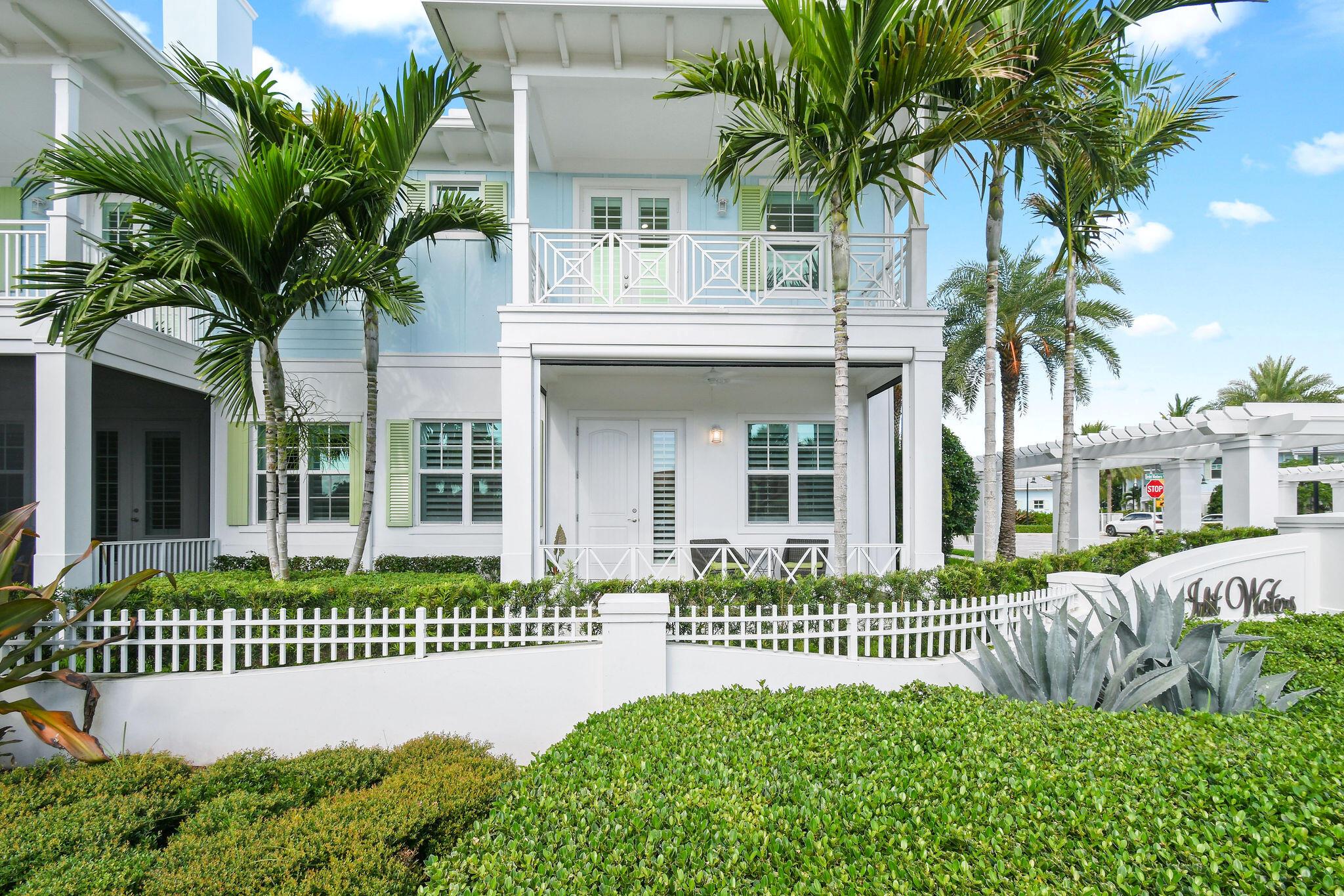 Welcome to Inlet Waters, an intimate gated community of just 33 coastal townhomes nestled on 4 beautifully landscaped acres in the heart of Jupiter. This desirable corner unit is ideally situated for privacy and convenience, with easy walkability to mini golf, popular dining spots, and the lively Love Street entertainment district. Plus, enjoy the added benefit of ample guest parking nearby.This home shows like a model, with professional interior decorating and thoughtful upgrades throughout, including hurricane impact glass, a metal roof, stainless steel appliances, and quartz countertops. Upstairs features a spacious loft with built-in desk, full laundry room, and a versatile bonus space perfect for a home office or in-home gym.
