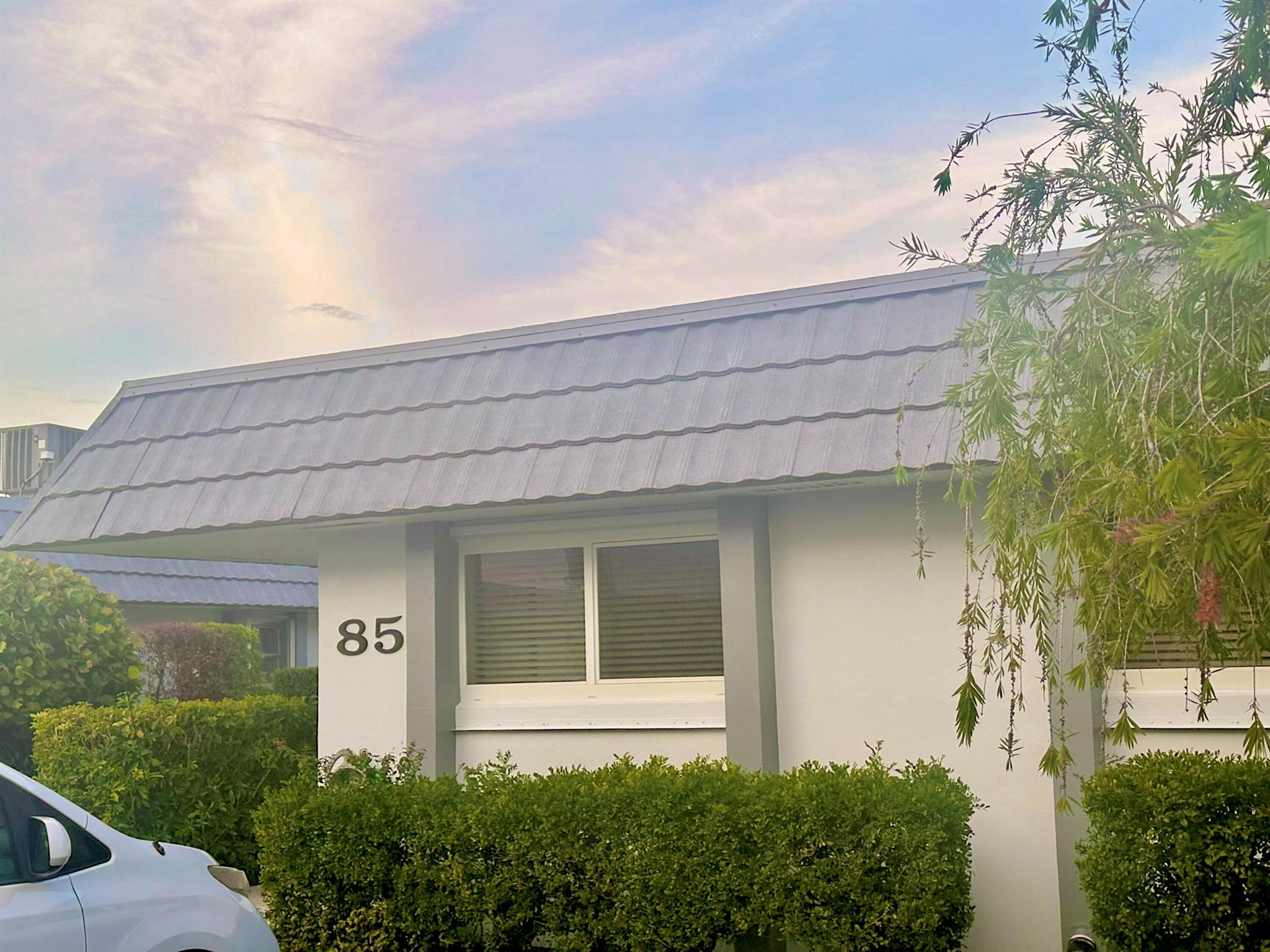 Make an offer on this 2 bedroom 2 bath villa located in the desirable 55+ community of Cresthaven in West Palm Beach. This corner unit offers added privacy and features a spacious enclosed patio perfect for additional living space. Enjoy serene expansive views as this villa backs up to a canal with plenty of green space and it is close to clubhouse, pool and tennis.