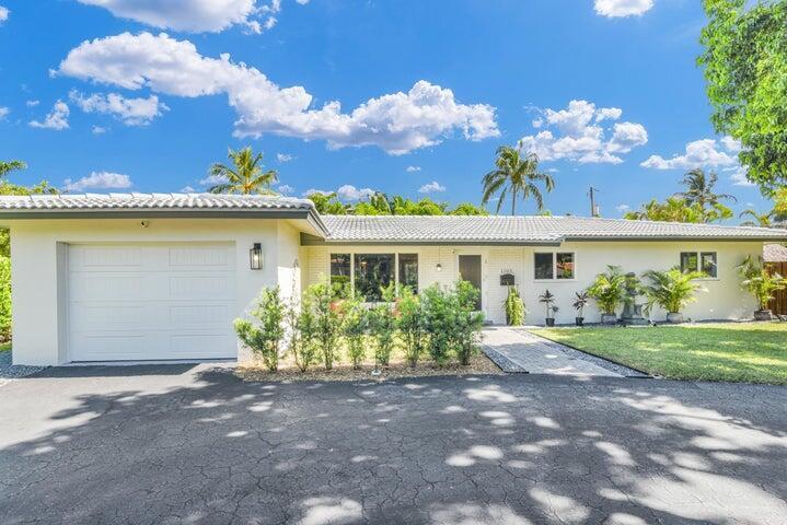 Live the Coastal Lifestyle in The Cove - Deerfield Beach. Welcome to The Cove, one of Broward County's most desirable beachside neighborhoods! Ideally located east of Federal Highway and just one mile from the sand and surf of Deerfield Beach, this beautifully maintained single-family home offers the perfect blend of comfort, style, and location. This spacious residence features 3 bedrooms, 2 bathrooms, and a 1-car garage, all within a bright, open floor plan that's perfect for both relaxing and entertaining. Set on a generous corner lot, you'll enjoy abundant outdoor space--ideal for gatherings, gardening, or soaking up the South Florida sunshine. Inside, the home showcases modern finishes, a well-appointed kitchen, and sunlit living areas that make everyday living feel like a retreat.