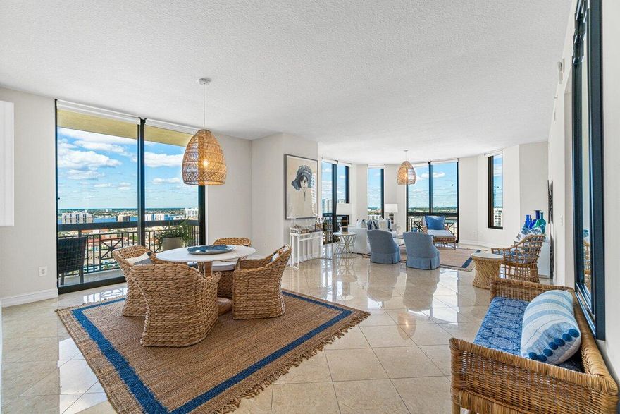 This spectacular penthouse residence is truly a magnificent home in the sky; with breathtaking panoramic city skyline sunset views and north corner ocean and intracoastal views. Highlighted by 12' ceilings, all marble flooring throughout main living and floor to ceiling glass and sliders that wrap around corner of the residence. Boasting 2,624sqft, this one-of-a-kind residence welcomes you with a light and airy spacious feel. This 3 bedroom, 3.5 bathroom plus den corner penthouse has had new wood flooring in bedrooms and new sunshade window treatments through main living areas and new paint throughout. Featuring an expanded balcony with Clear Lake and city skyline sunset views. The Penthouse residence also offers a flex space that can be a den/office with a closet an oversized laundry...