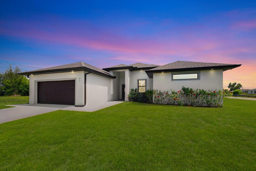 Now It's the perfect Time to buy! This gorgeous new construction on a freshwater canal could be the one! With an open concept floor plan and a sleek modern design, this home has everything you need and more. Here's what makes it stand out; 3 Spacious bedrooms + Den 2 stylish baths 2-car garage Gorgeous Italian Tile throughout the home. A kitchen that's chef approved wih quartz countertops, stainless steel appliances, and a french door refrigerator remote control ceiling standing tub, and a double-enry walk in shower with multiple showerheads and separate sinks. Plus, the under-truss lanai offers a spacious area for entertaining, and the home is built with hurricane impact windows and doors for peace of mind. It also includes a concrete driveway and auto-sprinkler system -low maintenance,