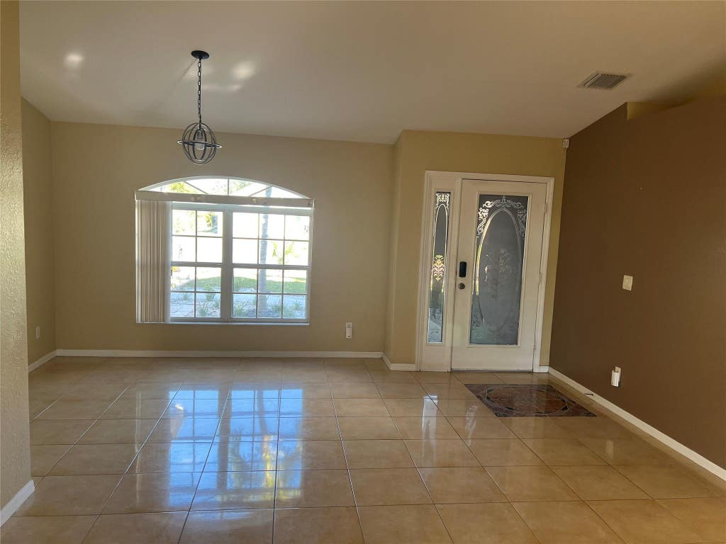 Photo of 2418 SW Brescia Street, Port Saint Lucie, FL 34953 (MLS # F10531862)