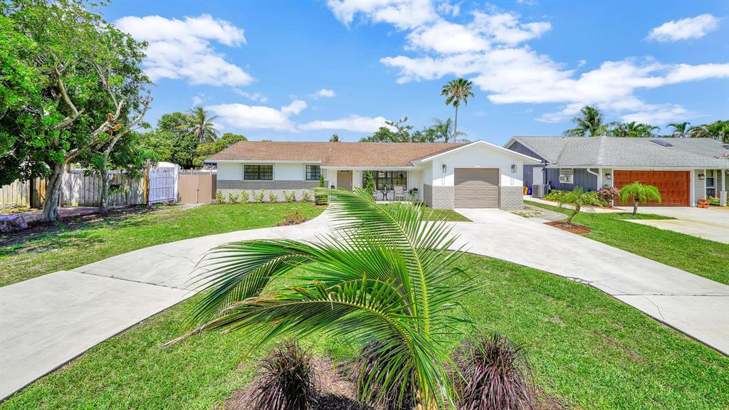 Welcome to this gorgeous 3 bedroom, 2 bathroom home with EXTRA large pool and elegant travertine marble pool deck. This property has a large completely fenced backyard, perfect for outdoor gatherings and entertainment. Large porcelain flooring throughout, modern kitchen, bathrooms, laundry room, epoxy garage floor, providing many modern finishes too many to list!! .... HURRY come take advantage of this rare opportunity to own ''Turnkey'' open concept floor plan offering plenty of natural light. Truly a bright and inviting home!! Minutes to shopping, highways, Downtown Atlantic Avenue & beaches. Come live the Florida lifestyle!