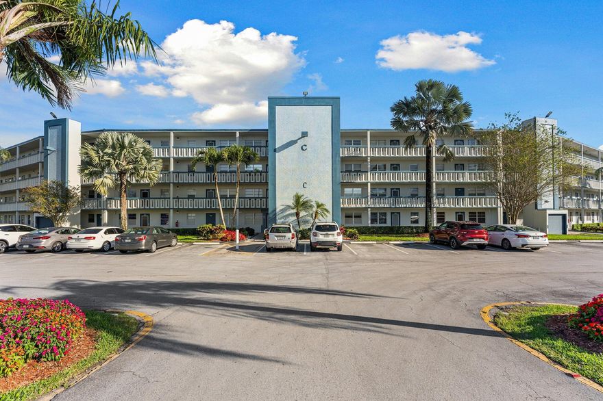 Welcome to 1047 Lincoln C in Century Village Boca Raton—a beautifully maintained first-floor condo offering comfort, convenience, and serene lakefront living in one of Boca Raton's most sought-after 55+ communities.  This light-filled residence features 2 spacious bedrooms and 2 full bathrooms, freshly painted interiors, and generous walk-in closets. The first-floor location provides effortless access from your dedicated parking space just steps from your front door—ideal for easy, everyday living.  Enjoy tranquil lake views from your screened-in patio, creating the perfect setting for morning coffee or evening relaxation. A private satellite pool is conveniently located just outside your building, offering a resort-style feel right at your doorstep. Private Storage unit available.   Residents of Century Village Boca Raton enjoy a vibrant, amenity-rich lifestyle with a stunning clubhouse, fitness center, card rooms, social clubs, entertainment, and endless activities designed to foster connection, wellness, and fun.  Whether you're seeking a full-time residence or a seasonal escape, this condo delivers the best of South Florida 55+ living in a peaceful, active community.  Make this your home today! Easy to show.