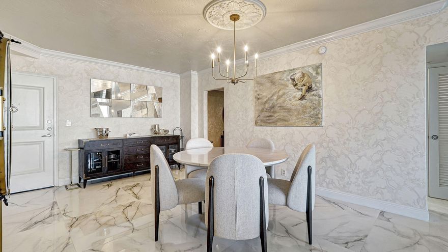 Located on the Intracoastal Waterway directly across from the ocean with private beach access, this highly upgraded 2-bedroom, 2-bath CORNER residence at 3000 S Ocean Dr offers stunning Intracoastal and city views. Features include 36'' x 36'' porcelain flooring, designer wallpaper, wood kitchen cabs w/ newer stainless steel appliances, and beautifully updated baths. Hurricane-resistant sliding glass door & windows  custom closets, designer moldings and baseboards, newer thermostats, and custom window treatments enhance the interior. Enjoy breathtaking sunsets from your private balcony or walk across to the beach. Resort-style amenities include two pools (Intracoastal and oceanside) and fitness center. Exceptional coastal living with private beach access. Walk  to many shops & restaurants!