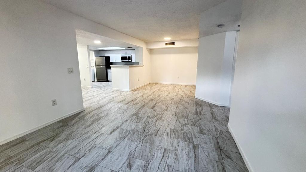 Photo of 5025 Wiles Road #107, Coconut Creek, FL 33073 (MLS # R11128846)