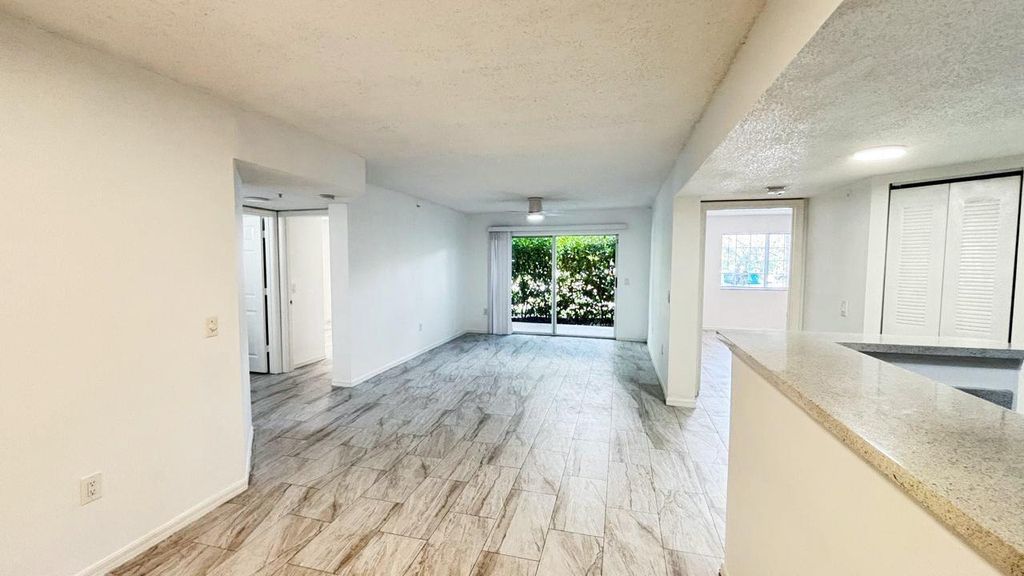 Photo of 5025 Wiles Road #107, Coconut Creek, FL 33073 (MLS # R11128846)