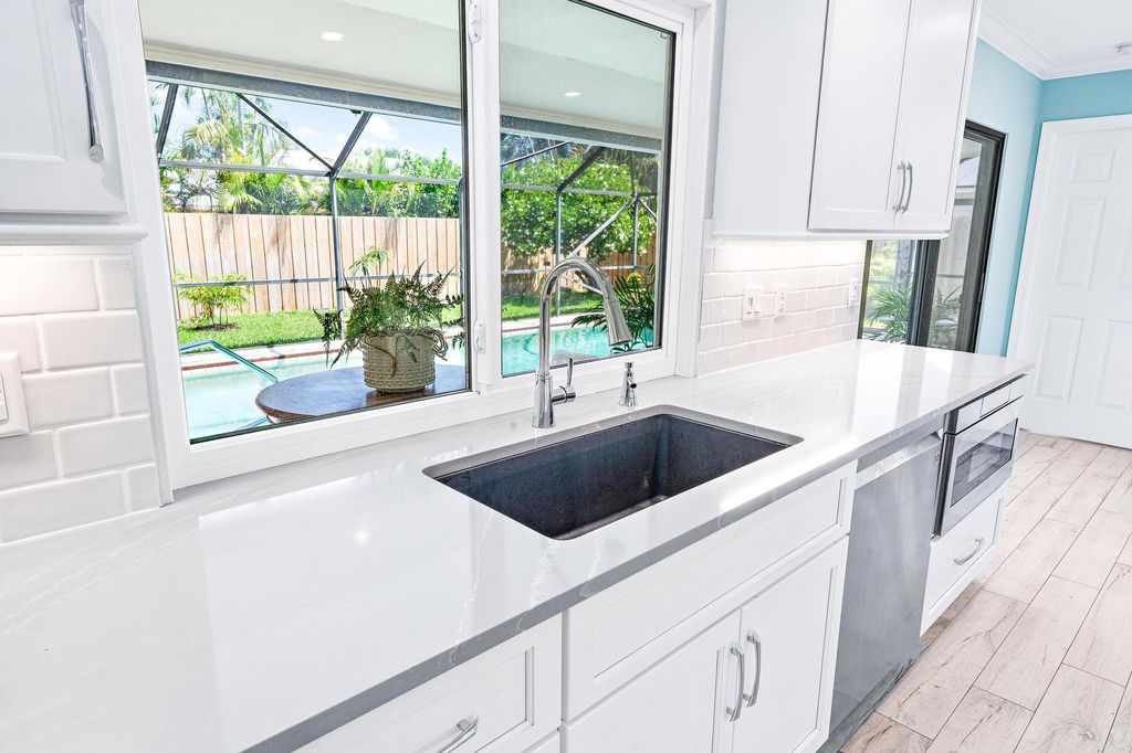 Photo of 89 Hickory Hill Road, Tequesta, FL 33469 (MLS # R10987425)