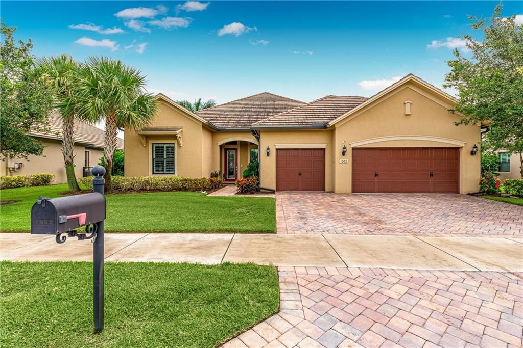 Photo of 1003 SW Cherry Blossom Ln, Palm City, FL 34990 (MLS # F10297769)