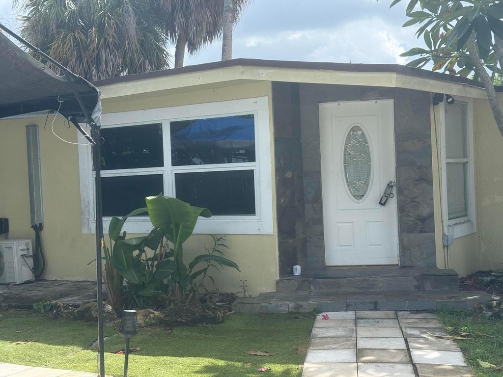 Photo of 192 CAROLINE Drive, West Palm Beach, FL 33413 (MLS # B26057267)