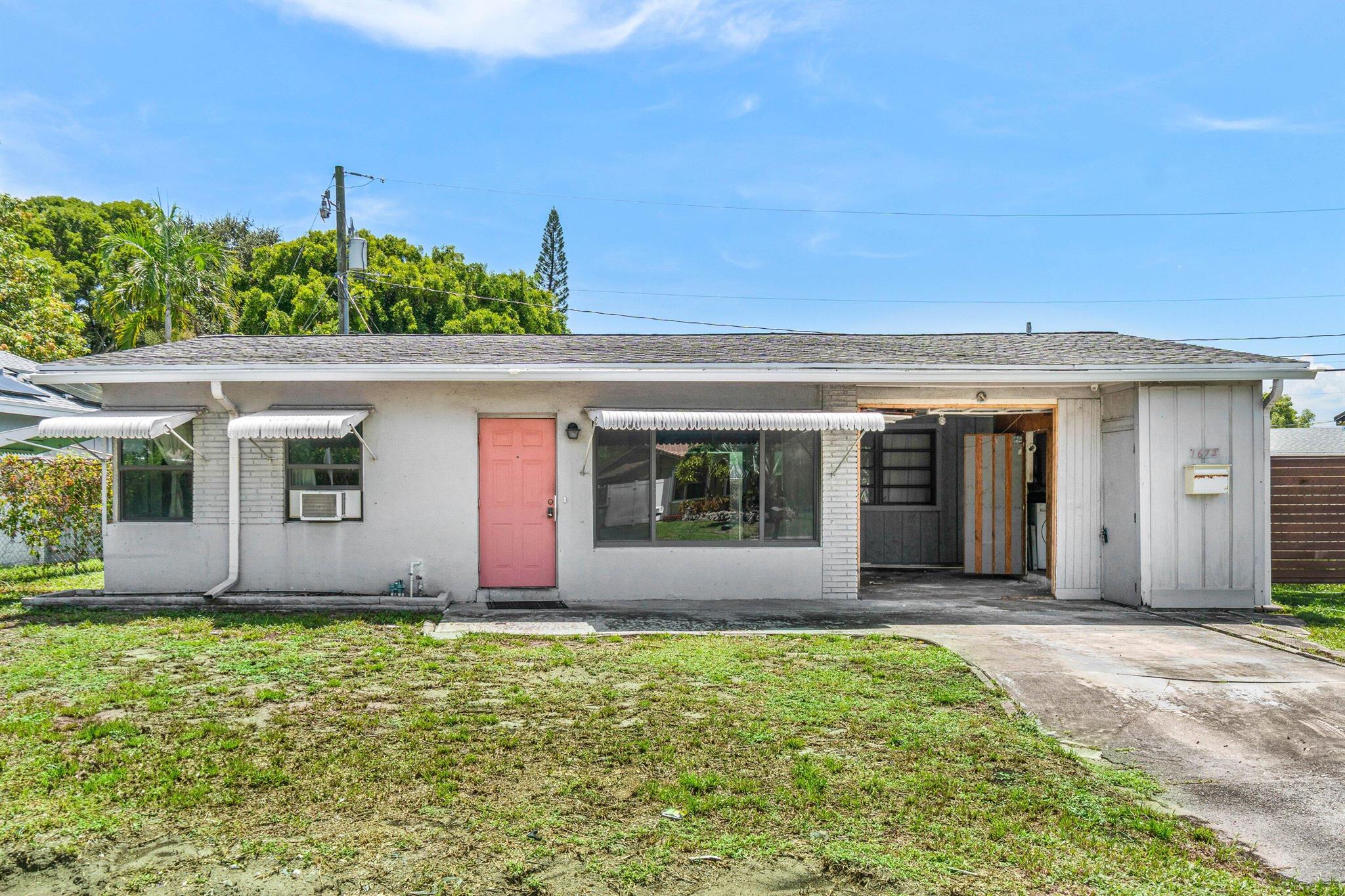 Excellent investment opportunity in one of Pompano's most desirable neighborhoods. Don't miss this chance to make a home your own in a prime East Pompano location, just minutes from the beach, shopping, restaurants, and I-95. This property features almost all impact windows, an eat-in kitchen with natural gas ready for a new cooktop, and a bright Florida room offering extra living space.The home also includes a carport with laundry room and ample storage, plus a large front yard with driveway and a partially fenced backyard, perfect for outdoor living. Solid bones and endless potential.