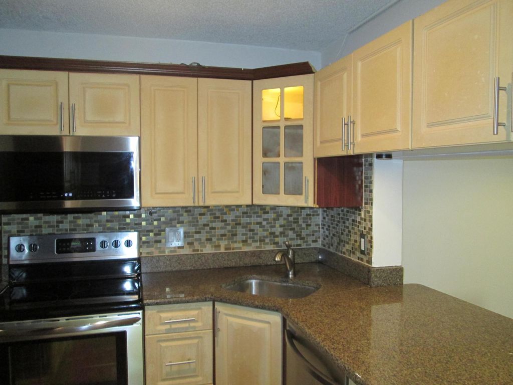 Photo of 209 Foxtail Drive #G1, Greenacres, FL 33415 (MLS # R11133370)