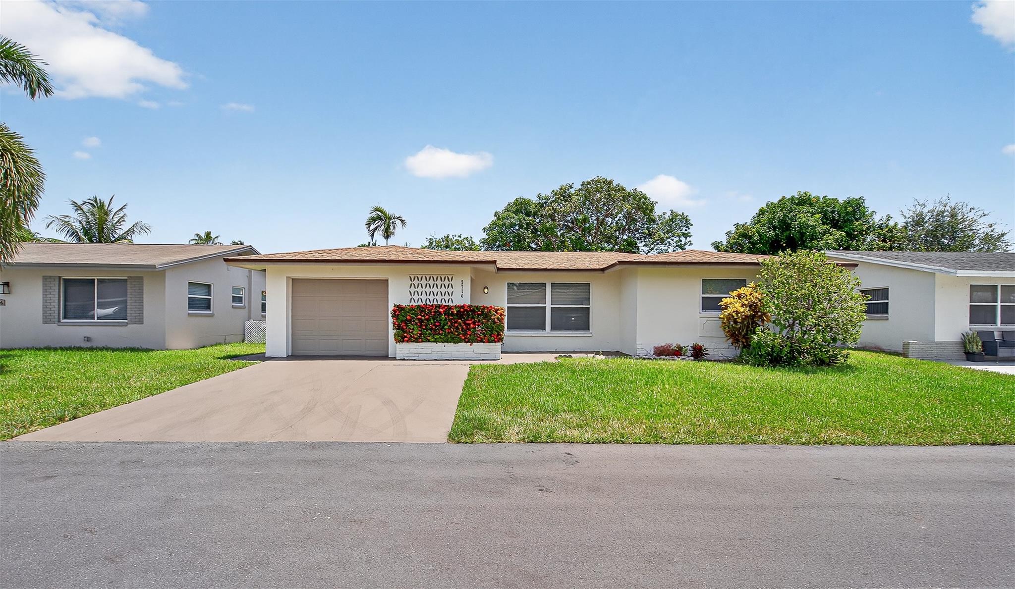 Fully remodeled 3 bed 2 bath single family home with a 1 car garage with featuring a brand new 2023 shingle roof, Updated Central AC system and hurricane impact windows/doors located in the well maintained mainlands of Tamarac Lakes with no HOPA restriction where all ages are welcomed. Other features include a new quartz countertop kitchen with wood shaker cabinets, stainless steel appliances, luxury vinly flooring, baseboards, recess lighting and updated electrical throughout. Spacious primary bedroom with a walk in closet and ensuite full bathroom. Ample sized guest bedrooms and a luxirious remodeled modern guest bath with a soaking tub. With no flood zone, low HOA fee of $63/mo includes lawn care, community pool and playground steps from the property. Book your showing today!
