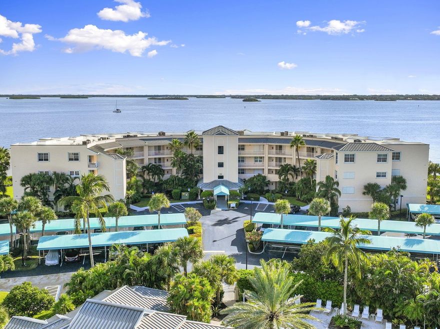 Location, Location, Location! A gem on Hutchinson Islands- Indian River Plantation! From the moment you open the door, the spectacular wide-water view will take your breath away! This beautifully updated, turn key furnished 2BR/2BA Bayview condo offers effortless coastal living. Enjoy care-free composite wood flooring throughout with plush new carpet in the primary suite (2024). Features include granite kitchen with newer appliances, fresh interior paint (2024), updated guest bath, HVAC (2022), and new water heater (2024). The enclosed porch provides all-weather comfort with stunning river views and complete privacy. Bayview offers exceptional amenities including a gated entry, clubhouse with fitness room, yoga area, lap pool, whirlpool, library, and full kitchen.