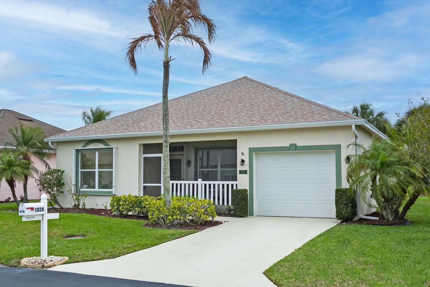 Located in the very active 55+ community of Kings Isle in St Lucie West, is this immaculate CBS home in move-in condition. Roof was replaced in 2023. Outside was also painted in 2023. This home features 2 bedrooms with 2 bathrooms overlooking a lake from the screen/glass window patio. A triple sliding door leads to a kitchen that has lots of counterspace with wood cabinets topped with crown molding.  Most windows have plantation shutters. Electronic air filter in the A/C system. Easy closing accordion shutters on all windows for storm protection. Lots of cabinets in the garage along with pulldown stairs. Don't miss this one.