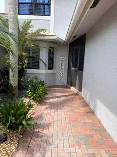 Photo of 3152 DEER CREEK LAKE SHORE Drive, Deerfield Beach, FL 33442 (MLS # B26059135)