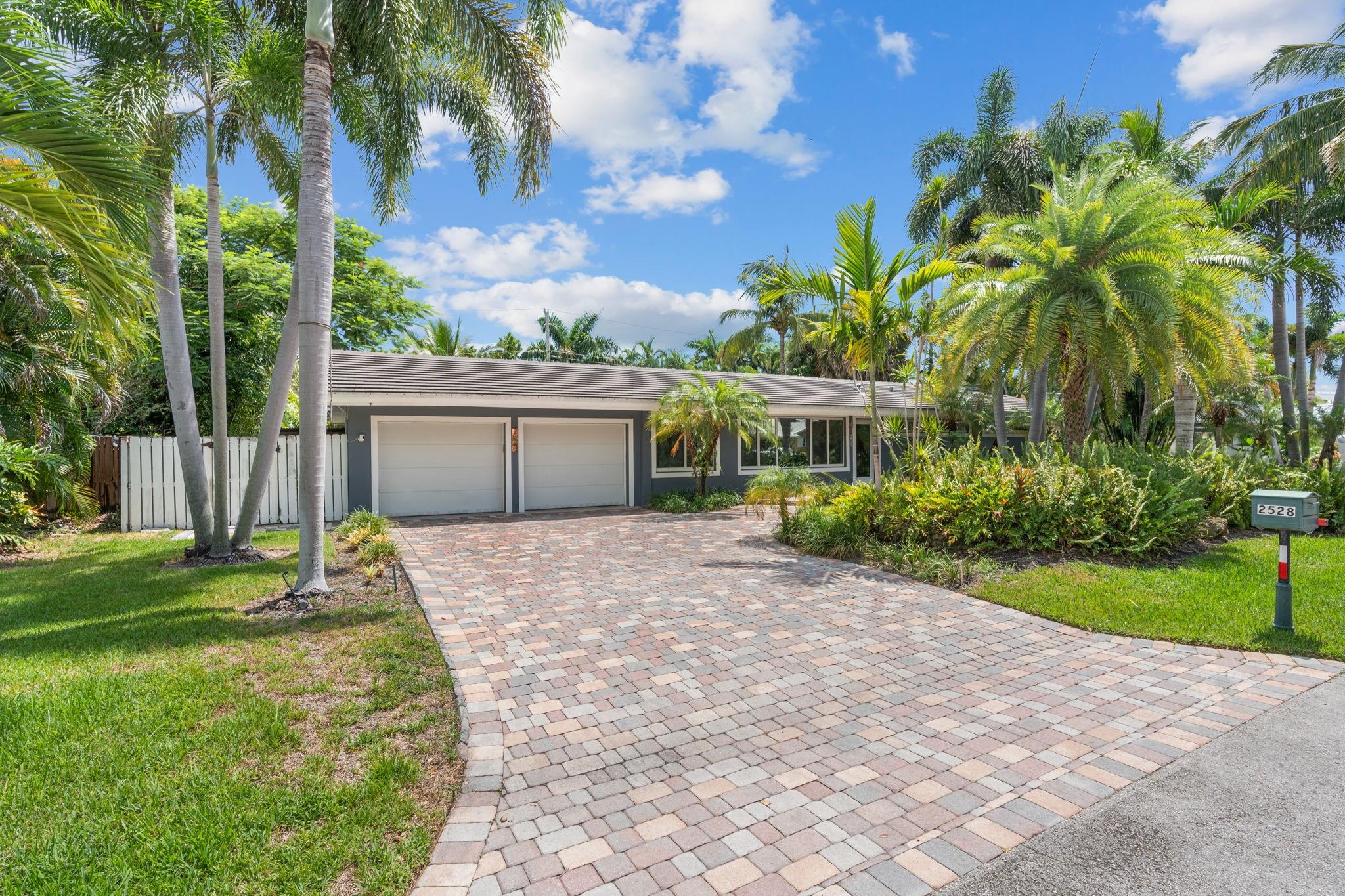 Located In The Highly Sought-After Coral Ridge Neighborhood, Within The Bayview School District. Soaring Vaulted Ceilings, An Open-Concept Layout & A Chef’s Kitchen Outfitted With High-End Appliances Create A Bright & Welcoming Ambiance. The Expansive Florida Room Seamlessly Blends Indoor & Outdoor Living, While Lush, Professionally Landscaped Grounds Provide A Private Tropical Retreat. Finishes Include Gleaming Marble Flooring, Sleek Quartz Countertops & A Generously Sized Walk-In Closet In The Primary Suite. Additional Highlights Include A Two-Car Garage, Impact-Rated Windows & Doors, Energy-Efficient Mini Split A/C Systems & A Resort-Style Heated Pool With An Integrated Spa. Tucked Away On What Is Arguably One Of Coral Ridge’s Most Coveted Streets, And Just 1.6 Miles To The Beach.