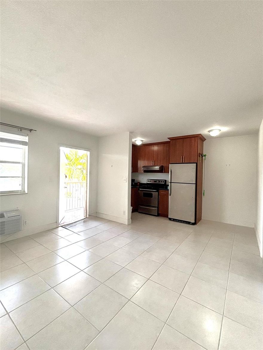 IMMACULATE CORNER UNIT! This bright 1/1 is in great condition and ready for move-in. Features a highly desirable assigned parking space just steps from the door. Unbeatable location near Wilton Manors, beaches, and shopping hubs. Perfect for an end-user or investor—can rent immediately! This is a rare find that won't last.