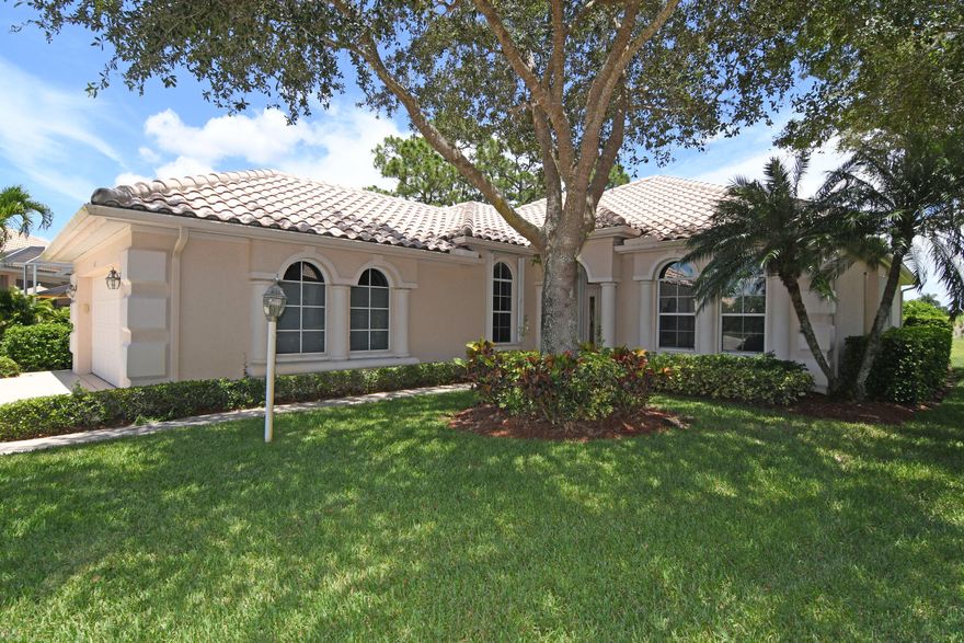 Picturesque two bedroom, two bath, with study (or possible 3rd bedroom), pool home with views of the Ryder course - features tile throughout the living areas, tray and vaulted ceilings, granite counter tops, newer appliances, 2016 AC, laundry room with separate sink, accordion shutters, heated pool... located within PGA, with access to the Island Club which includes a fitness center, tennis, basketball, library, billiards, play area, resort style pool, & many more activities.