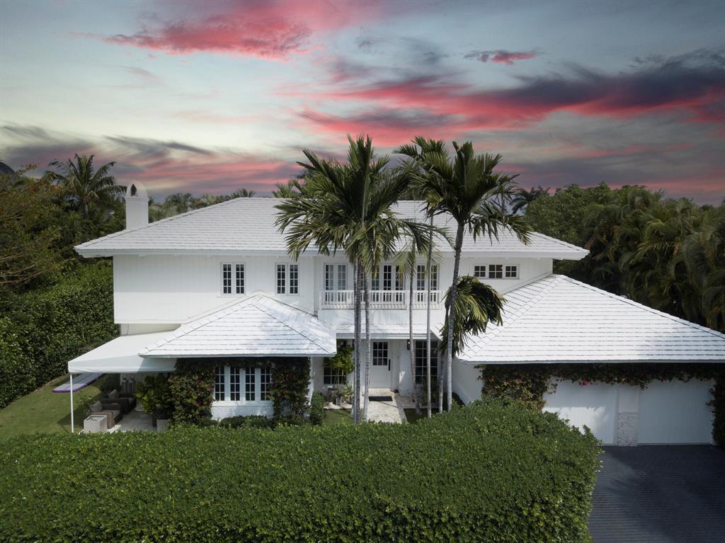 Rarely available renovated Island style home on exclusive Queens Lane, one of the most sought after cabana streets on the North End of Palm Beach. Offering quintessential North End living with a fully updated beach cabana, deeded beach access, and one of the only day docks on the intracoastal for the exclusive use of homeowners on the street. The 4 bedroom and 4.5 bath home was gut renovated in 2014 and features a first floor open plan, chef's kitchen with six burner Viking range, and custom oak cabinetry. The layout provides ample space with a den/office soaked in natural light and a sitting area off of the kitchen. The large open front yard with covered patio and mature hedges offers distinct privacy from the street.
