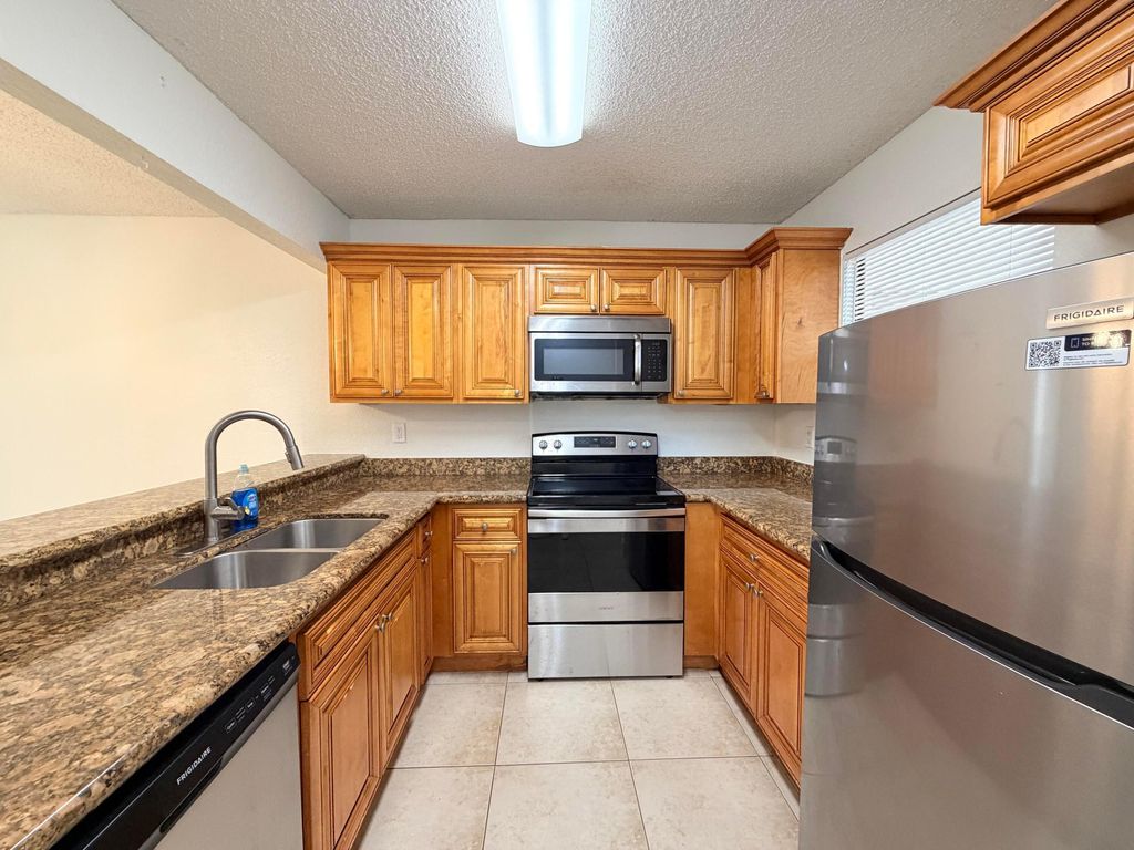 Photo of 1541 Windorah Way #E, West Palm Beach, FL 33411 (MLS # B26044999)