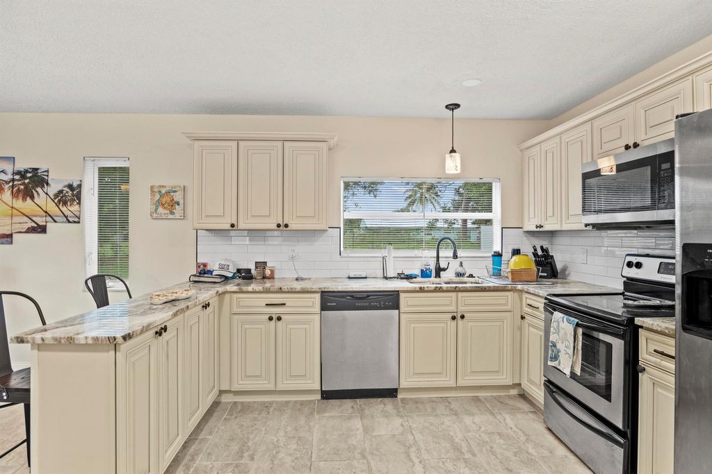 Photo of 232 SW Kimball Circle, Port Saint Lucie, FL 34953 (MLS # R11123099)