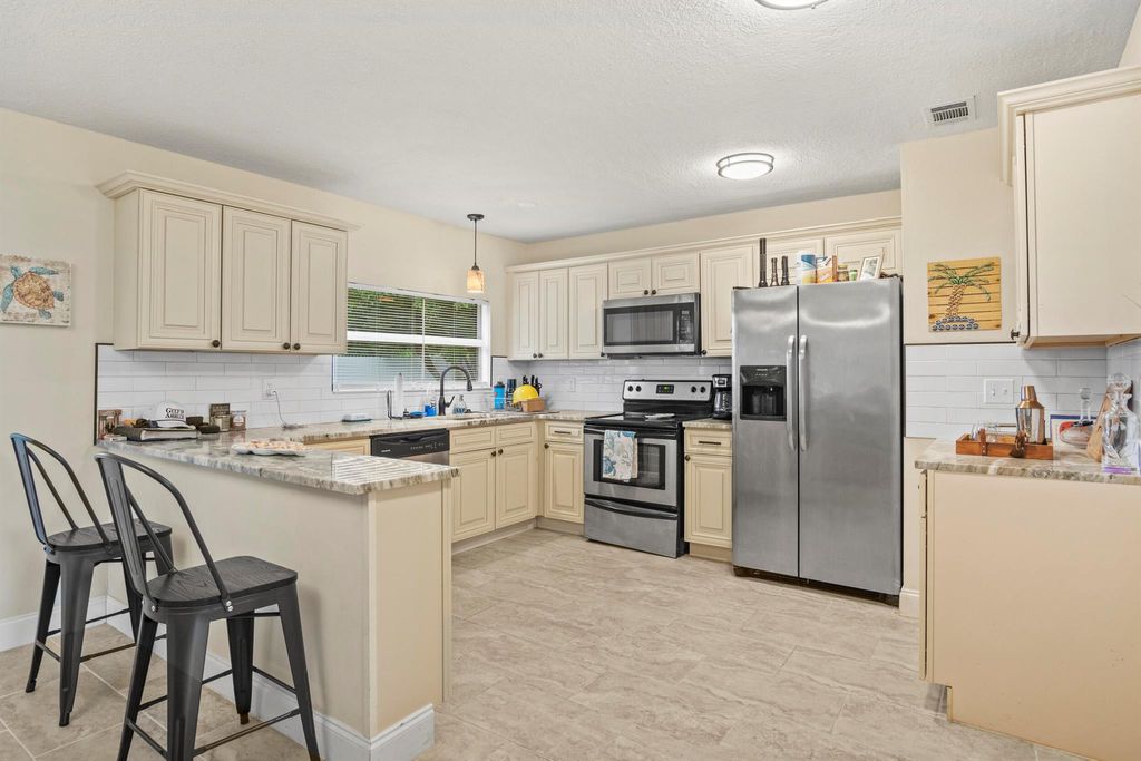 Photo of 232 SW Kimball Circle, Port Saint Lucie, FL 34953 (MLS # R11123099)