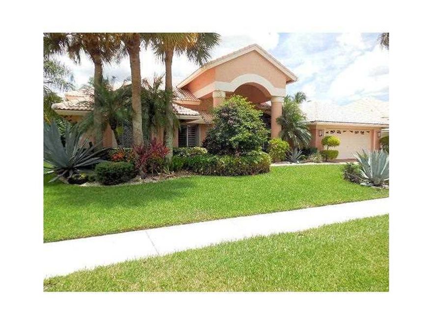 FANTASTIC LAKEFRONT POOL HOME! Pride of ownership in this lushly landscaped home boasting countless upgrades including a gorgeous pool resurfaced in 2014, complete w/salt water system, hot tub, outdoor shower, & extended patio -perfect for spending qualit y time with friends & family. The Grand Cayman IV model has a dramatic entryway, w/volume ceilings, a large open split bedroom floor plan, & sliding glass doors overlooking the pool & scenic lake views.