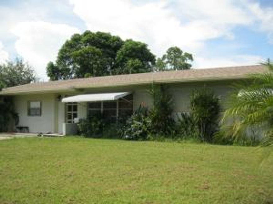 Nearly one third acre, corner lot, large, fenced backyard in none HOA community. New roof, 2006. Brand new compressor and condenser. Great central location, a hidden gem, tucked back from main road. Open floor plan with large 20 X 14 great room.  Large bedrooms. Tile throughout.  Enclosed Florida room with wood beamed ceiling has wall a/c unit so could be used as 5th bedroom. Main bath has granite and Jacuzzi tub. Large storage shed in back yard. Back yard is large enough for a soccer game! Side driveway great for parking extra vehicles, boat, RV, etc.