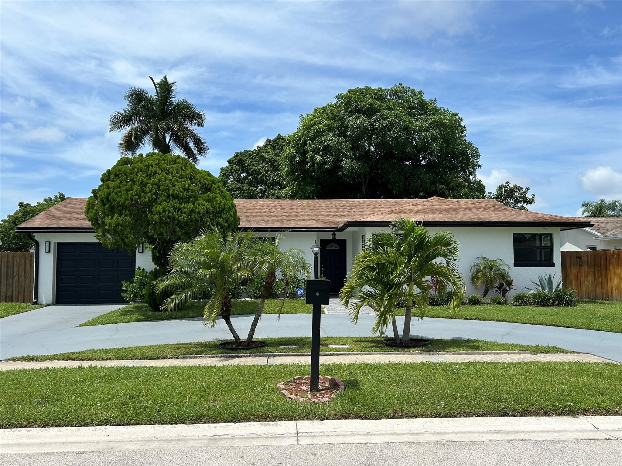 Welcome to this beautifully maintained home offering tile floors throughout, cathedral ceilings, and an abundance of natural light. The spacious Florida room is fully enclosed and air-conditioned, perfect for a game room or home theater. Enjoy cooking in the updated kitchen featuring granite countertops, stainless steel appliances, a new refrigerator. new washer & dryer, Impact windows for added security and energy efficiency, Large, fenced backyard – ideal for kids, pets, or outdoor gatherings, Circular driveway with ample parking, No HOA – fast and easy approval process. Located in a family-friendly neighborhood with top-rated schools, close to parks and local amenities. This home truly checks every box – comfort, style, and location. A must-see 10+ property!