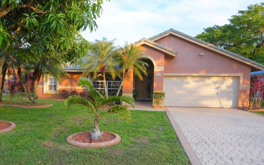 Photo of 4555 NW 88TH Terrace, Coral Springs, FL 33065 (MLS # B26078256)