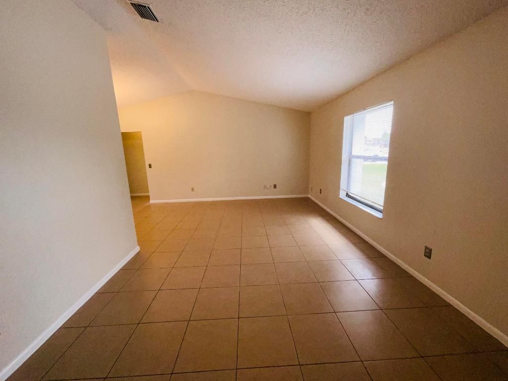 Photo of 2020 SE Parrot Street, Port Saint Lucie, FL 34952 (MLS # R10980499)