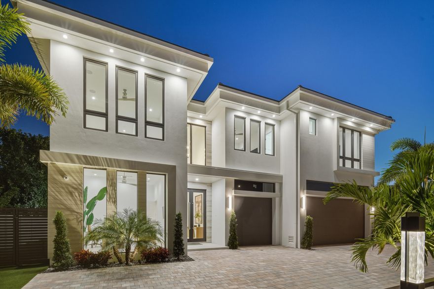 From the moment you step inside, it's clear this is no ordinary Mizner Park residence. A grand foyer, an impressive executive office, and a true first-floor primary suite set the tone for a home that feels equally extraordinary whether you're enjoying a quiet evening in or hosting an unforgettable night with friends. Sunlit interiors blur the line between indoors and out, yet retain an inviting warmth—perfect for a cozy movie night with candles glowing and slippers on. Thoughtfully designed for both everyday living and elevated entertaining, the home offers five ensuite bedrooms, including a sumptuous first-floor primary. Upstairs, four grand suites surround a spacious secondary living area, ideal for guests, family, or a private retreat. The open-concept great room flows -- seamlessly into the dining area and designer kitchen, outfitted with Wolf and Sub-Zero appliances and supported by a fully equipped secondary prep zone with extra refrigeration, a second sink, and expansive wine storage.

The backyard oasis features a separate cabana structure features a full summer kitchen and bar. Slide open the doors to reveal your private outdoor retreat complete with a 48-inch Wolf grill, bar seating, a waterproof SunBrite TV, saltwater pool, and spa. From intimate alfresco dinners to lively celebrations, this space is designed to make every moment memorable.

Of course, the home is fully loaded:  full-house generator, integrated speakers in every room, TVs installed inside and out, commercial-grade WiFi, security cameras, an automatic driveway gate, and wireless pool controls all accessible from your phone wherever you are in the world.