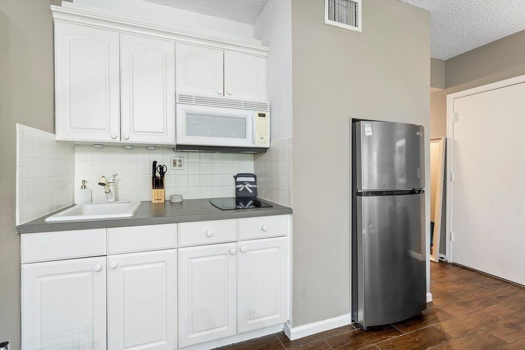 Photo of 11863 Wimbledon Circle #407, Wellington, FL 33414 (MLS # B26012254)