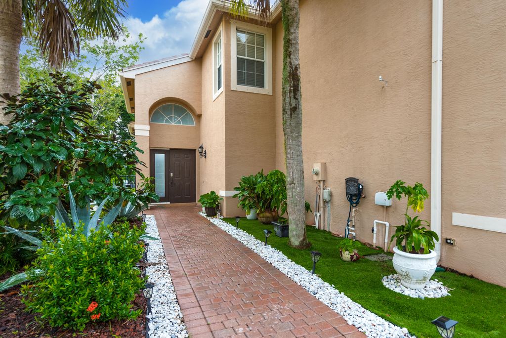 Photo of 622 S Peppergrass Run S, Royal Palm Beach, FL 33411 (MLS # B26031587)