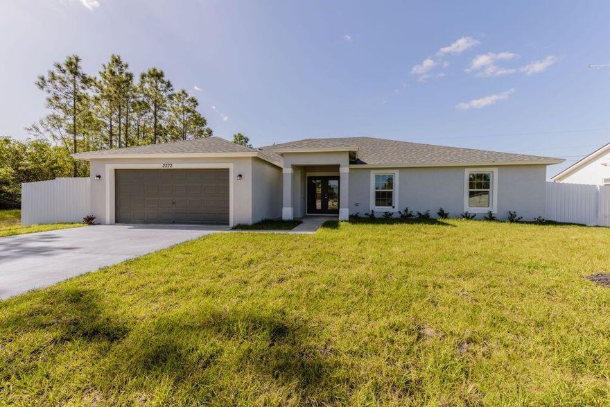 Fall in love with this solid CBS home in a prime Port St. Lucie location! Built for comfort and energy efficiency, this home features impact windows and doors, energy-saving construction, and tile flooring throughout -- no carpet here! The kitchen and bathrooms shine with granite countertops, offering both style and durability. Enjoy a fully fenced backyard that's perfect for pets, play, or relaxing in your oversized covered terrace -- ideal for entertaining or unwinding outdoors. This home combines beauty and function, with peace of mind built in. Close to everything--shopping, schools, dining, and major roads--yet tucked away in a quiet neighborhood with no HOA. Don't miss this opportunity! Seller is motivated and offering a special buyer incentive - ask your agent for details!