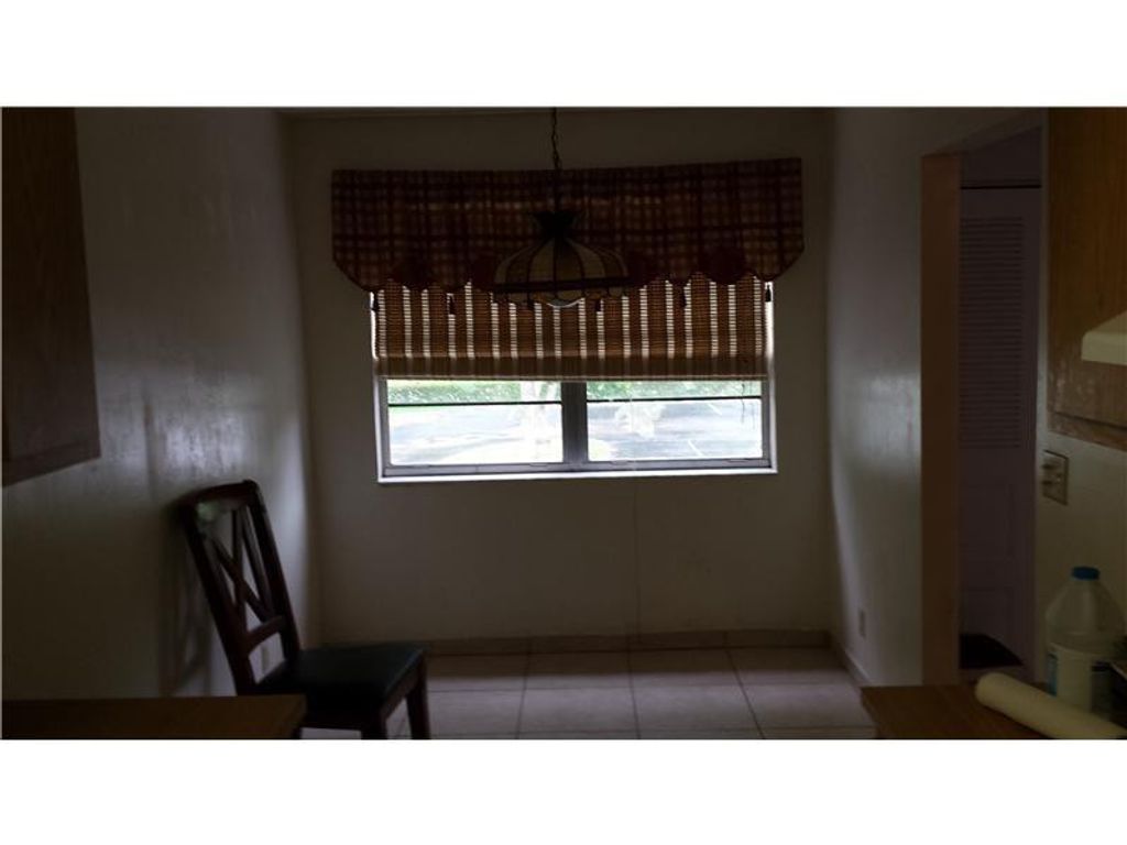 Photo of 8450 Lagos De Campo Boulevard #201, Tamarac, FL 33321 (MLS # B26013623)