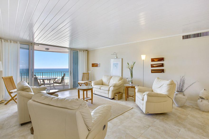 Best Deal in PB! Awesome penthouse unit w/a NE ocean & intra-coastal views from every rm, updated throughout w/a tropical Key West flare & can be sold furnished, impact windows w/additional accordion metal shutters on the balcony, neutral colored tiled flooring throughout, tongue & groove painted ceilings, crown molding, high hat lighting, upgraded ceiling fans & lighting fixtures, newer A/C system & hot water heater, built-in shelving, surround sound throughout, split bedroom suites, extra closets for storage, kitchen offers all S/S appliances, custom granite counter-tops, cabinets w/soft close drawers & frost glass drs, pantry w/pull out drawers, breakfast & serving bar, both bathrooms beautifully upgraded, also offers a storage locker & an underground garage parking spot. See it today!