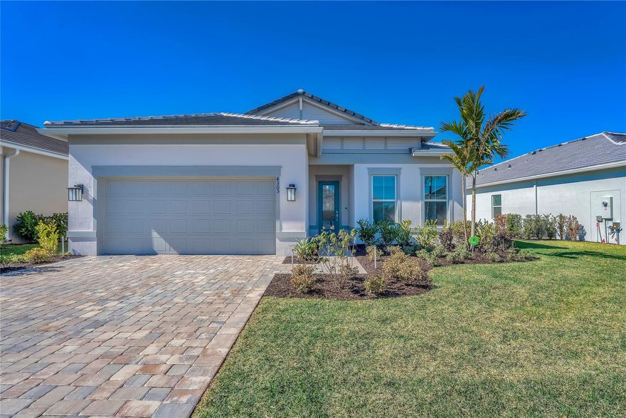 Beautifully upgraded new construction home with over $265,000 in builder and post-closing upgrades. The open layout features a built-in kitchen with upgraded cabinetry, countertops, backsplash, KitchenAid appliances, and pendant pre-wiring, flowing into the gathering room. Zero-corner sliding doors open to an extended covered lanai and private pool for seamless indoor-outdoor living. Interior upgrades include luxury vinyl plank flooring, 8’ solid-core doors, crown molding, recessed LED lighting, and two-tone paint. Split floor plan offers 3 bedrooms, 3 baths, a private den, upgraded laundry room, custom closets, motorized window treatments, outdoor speakers, security system, and garage upgrades. Move-in ready.