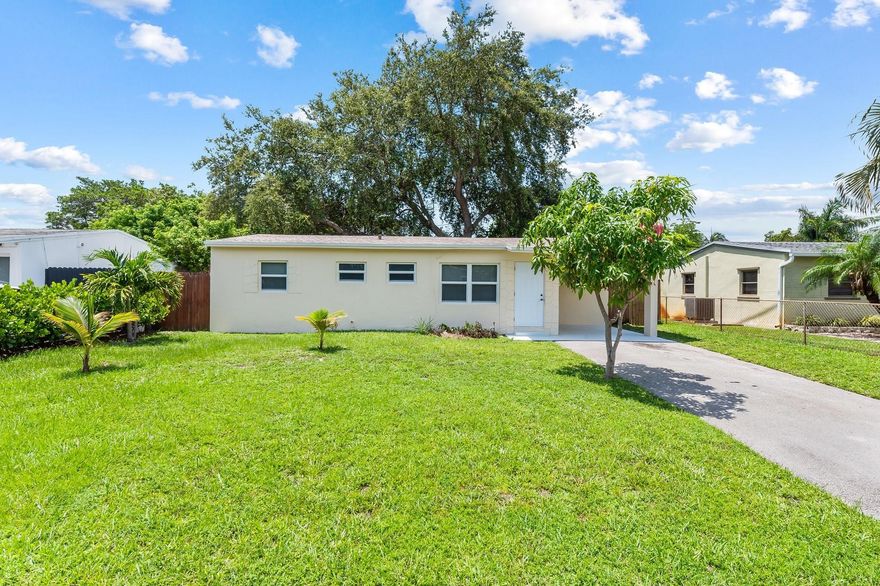 Light and bright originally built 3/2 with 1 car carport. Ready to move in!  Brand new roof in 2024. Impact windows throughout- central ac replaced 2016. Updated white kitchen, bathrooms, 200 amp electric panel and water heater.  Full-sized inside washer/dryer. Beautiful large fenced back yard with mature landscaping. Lawn service included in rental payment. Good credit and job history required .