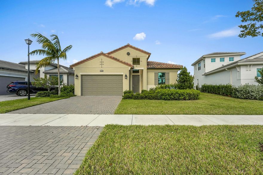 This 2024 CBS home in PGA Verano offers a split floor plan, premium upgrades and a move-in-ready lifestyle. Featuring 3BR/2BA, this bright and open layout includes impact glass, sleek tile flooring, quartz counters, stainless appliances, 16'x10' sliders, and a large kitchen island. The extended lot showcases long lake views, ideal for a future pool. Enjoy a spacious primary suite with spa-like bath and walk-in closet. Verano's resort-style amenities include indoor/outdoor pools, 27 pickleball courts, clubhouse, fitness, tennis, and more. HOA includes cable, internet, lawn care, and security.
