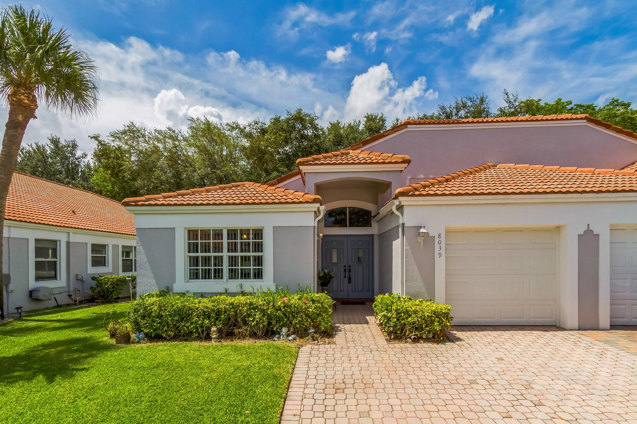 Welcome to this stunning corner Villa in the desirable Waterways of Delray Beach—a gated, all-ages community offering exceptional value and amenities. Bathed in natural light, this 2 BR, 2BA home boasts a thoughtfully upgraded Kitchen with granite countertops, vaulted ceilings plus impact-rated windows & garage door for peace of mind. Your spacious Master Suite features a walk-in closet and beautifully renovated Ensuite Bath w/dual-sink vanity, walk-in shower & soaking tub. A sunlit enclosed patio, also with impact glass, opens directly from the Master and offers the perfect space for a Home Office, Bonus Room,or serene retreat, separated from the main living area by elegant glass doors.