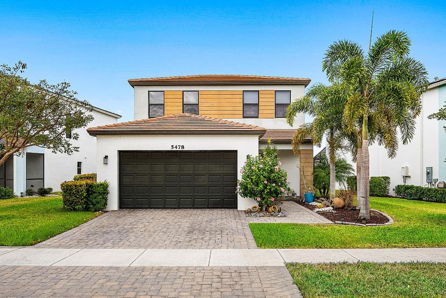 Enjoy lakefront living in this 4-bedroom, 2.5-bath, two-story home located in Skycove at Westlake. This home features a large open floor plan perfect for entertaining, tile throughout, and a first-floor primary suite for added convenience. The kitchen and baths are upgraded with granite countertops and light gray shaker cabinets. Relax outdoors in the fenced yard or screened-in patio overlooking the lake. Westlake offers unmatched resort-style amenities including a lagoon pool, three-story waterslide, splash pad, cabanas, snack shack, outdoor concert pavilion, playgrounds, dog park, and more.