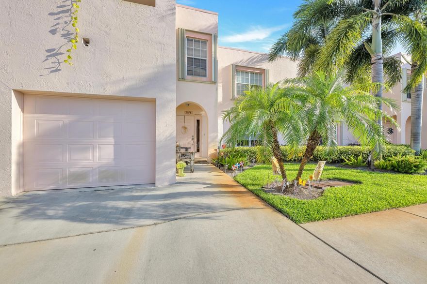 Welcome to 2078 SE Wild Meadow Circle in the quiet little community of The Meadows. This stunning two bedroom ground floor condo offers 1,498 sq feet of living space as well as an enclosed Florida room.
The kitchen has been tastefully updated with high end cabinetry and gorgeous granite top breakfast bar that can seat five. Attention to detail in this unit shows.  Kitchen overlooks dining and living space. Custom easy open shade installed on slider door in living room. Built in wine rack and cabinet to display your glasses or china. Space for wine fridge. Large diagonal tile throughout the entire unit. All rooms in this condo are spacious. Master bedroom features french doors that open to the Florida room. Master bath features high end vanities with double sinks. Truly a must see.