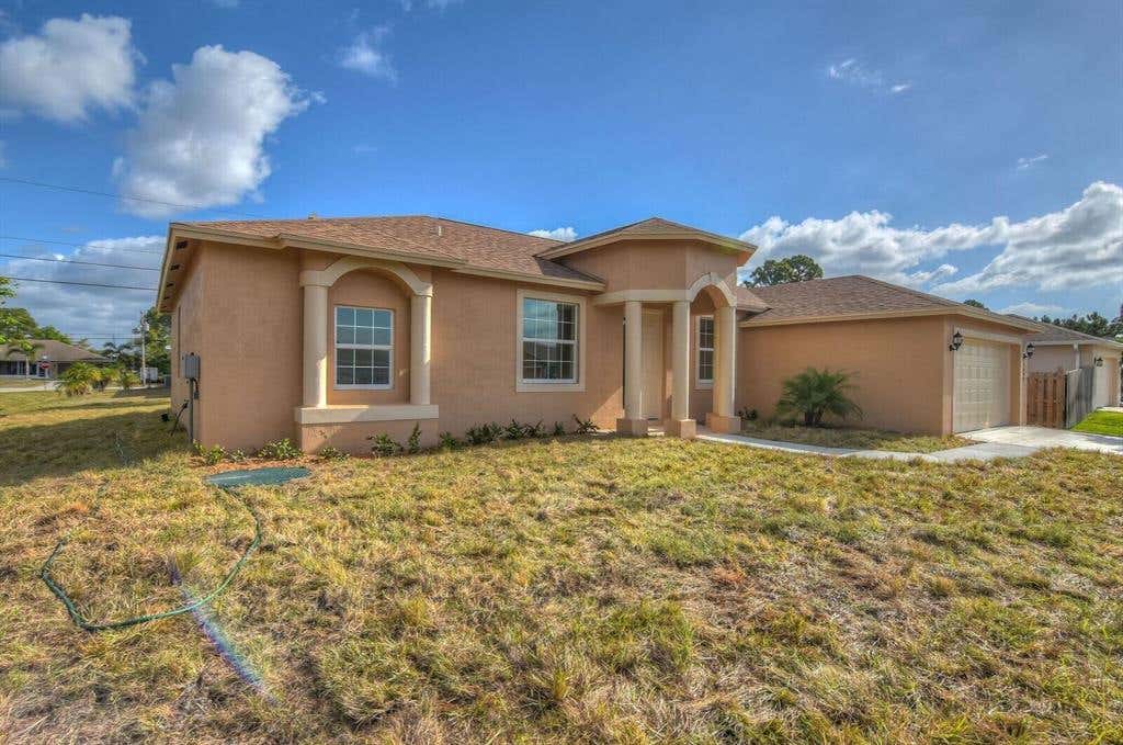 Photo of 1762 SW Dreyfuss Boulevard Blvd, Port St Lucie, FL 34953 (MLS # R10808320)