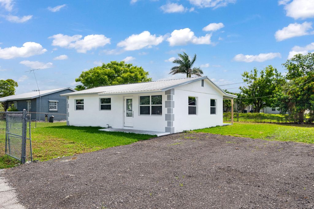 Photo of 245 SW 11th Avenue, South Bay, FL 33493 (MLS # B26036083)