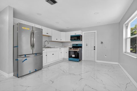 Tiny photo for 245 SW 11th Avenue, South Bay, FL 33493 (MLS # B26036083)