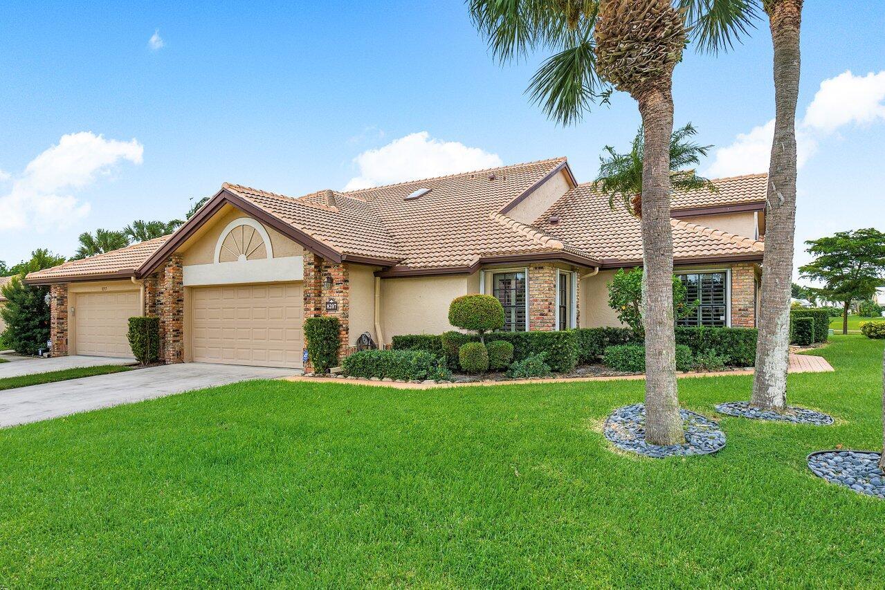 Welcome to Aberdeen Country Club, the epitome of Luxury Living. This prime 3 bed/2 bath well-maintained villa located on hole-6 boasts vaulted ceilings, engineered hardwood floors, newer Bosch appliances, & custom plantation shutters. The enclosed lanai expands the interior living space, seamlessly blending indoors with the outdoors. An awning-covered patio provides shade while taking in serene lake and golf course views from a fenced-in yard. This home features many enhancements: updated garage floor, new AC UV light & pump, new roof 2022, master bath renovated in 2018, guest bath updated in 2017, & central vac. Aberdeen Country Club offers resort-style living with Golf, Tennis, & Social Memberships available as well as bar/restaurants, pro-shops, and spa-like pools with towel service.