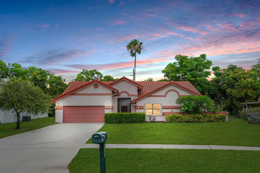 This is an exceptional opportunity offering unlimited potential to make this home your own!  Situated on a prime waterfront lot, this spacious home features 4 bedrooms, 2 bath, 2 CG with soaring ceilings and beautiful water views. Recent improvements include NEW freshly painted interior, New carpeting in living room and bedrooms, A/C 2025, Newer Refrigerator and newly pressure cleaned. This home presents the perfect canvas for customization and renovation, whether you're an investor looking for an upside potential or a homeowner with a vision. Sun Valley is a desirable community, with a prime location, low HOA and offers wonderful amenities. This is a must see!