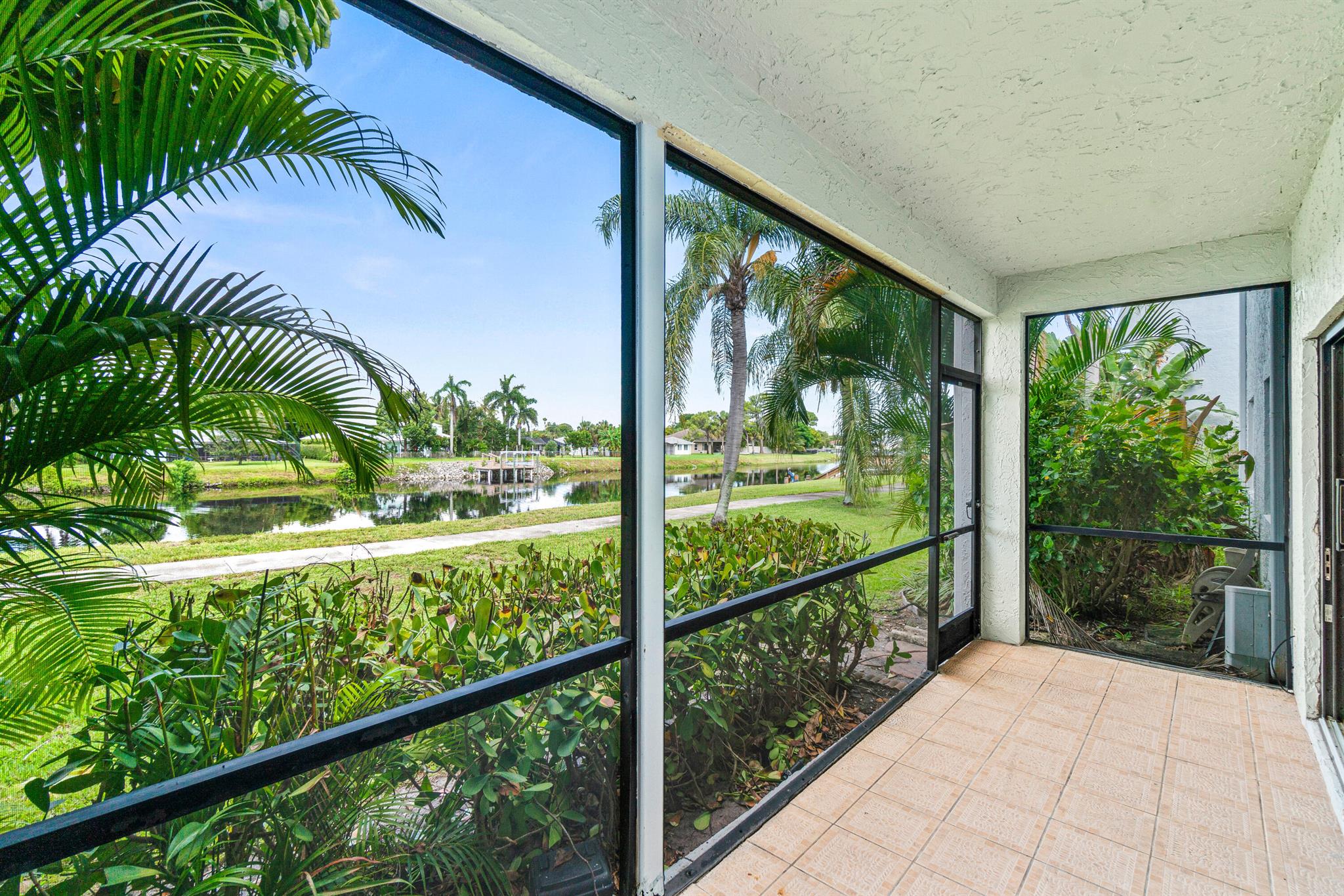 This beautifully updated unit inside a gated, boutique community of only 53 residences. Enjoy peace of mind with impact windows and doors, a newer A/C with UV light, and a tankless water heater. Step inside to a fully renovated interior boasting over $100K in upgrades. The sleek kitchen features a double-sided quartz island, shaker wood cabinets, and top-of-the-line LG black stainless steel appliances, including an induction stove. Custom 8-foot tall, extra-wide interior doors add to the upscale feel. This unit comes with two parking spaces directly in front and ample guest parking. The community's serene location is perfect for paddleboarding, kayaking, or just relaxing and enjoying the view. You're just minutes from shopping, movies, and only 10 minutes to Downtown Delray Beach and the